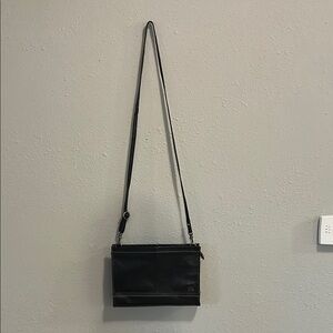 The Sak Iris Demi Clutch Black Leather Crossbody Bag‎